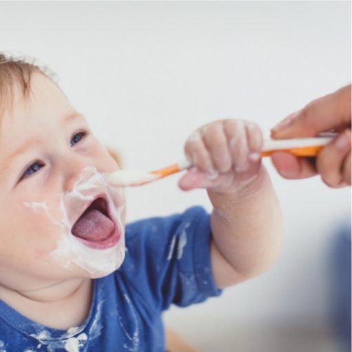 baby food going into baby's mouth