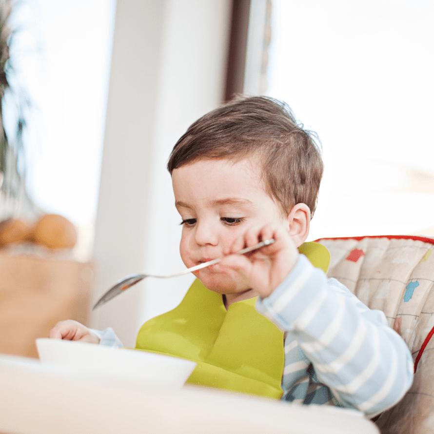 Episode art for episode: “#62: Do Toddlers Need Bedtime Snacks? Learn When To Offer Them, What Types of Foods To Offer, and When They Can Be Problematic! ” Pictured is a little boy in pajamas eating a snack from a bowl.