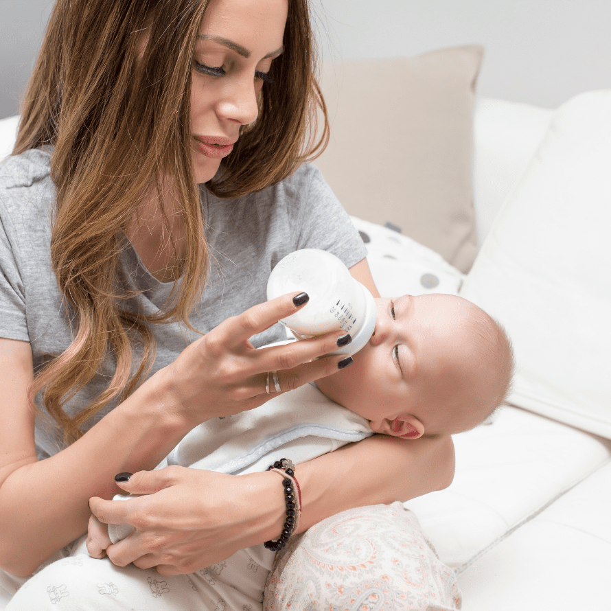 Mother bottle feeding her baby