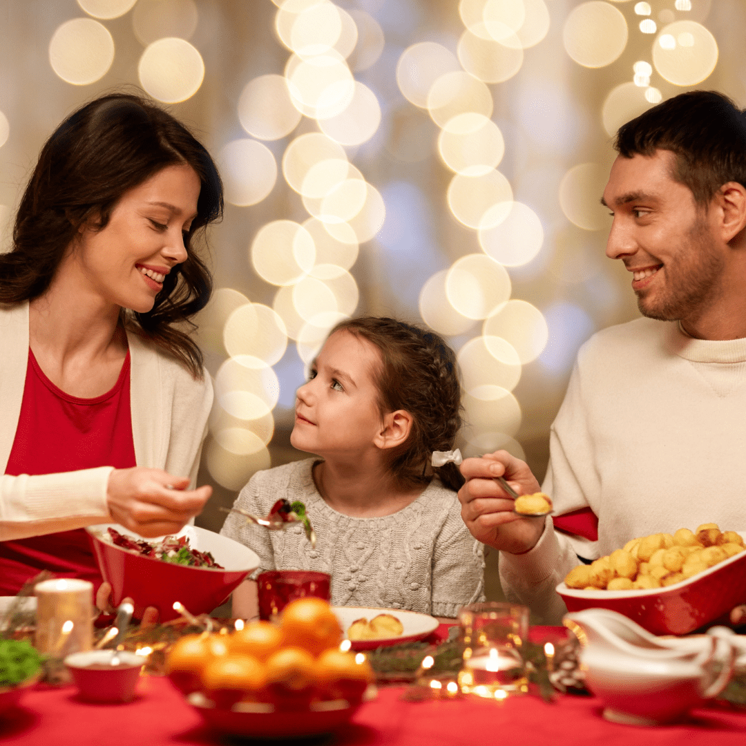  Little girl eating holiday dinner with family