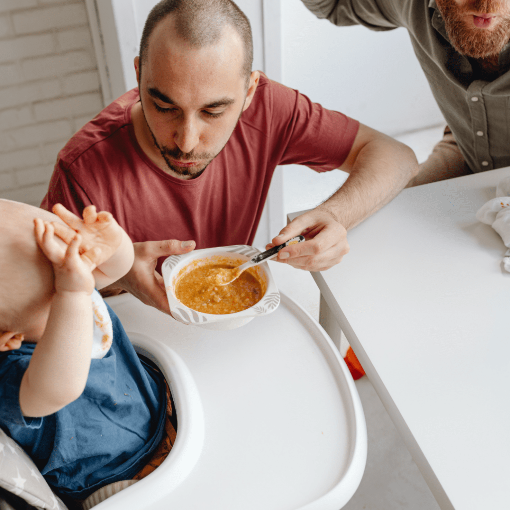 parents serving own baby food